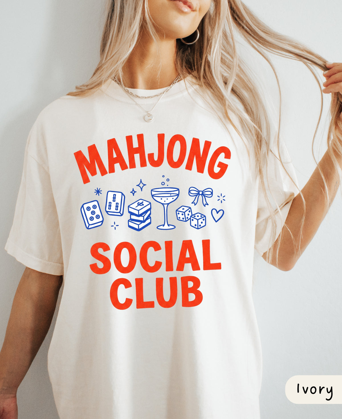 Ivory Mahjong Social Club tee front view, red and blue mahjong tile, dice and cocktail design