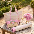 Blush pink mahjong tote bag set with tile pouch and pusher bag on a garden table
