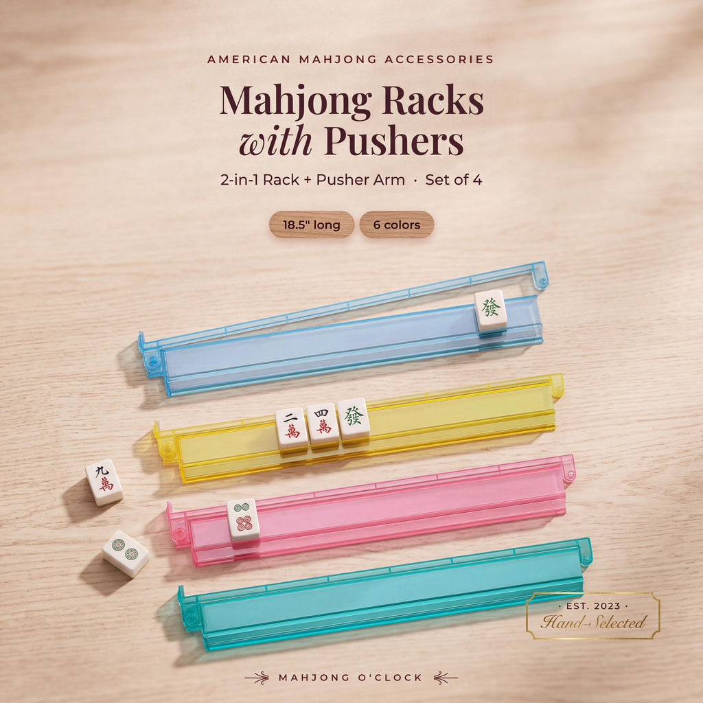 Clear acrylic mahjong racks with pushers holding mahjong tiles on a wood table