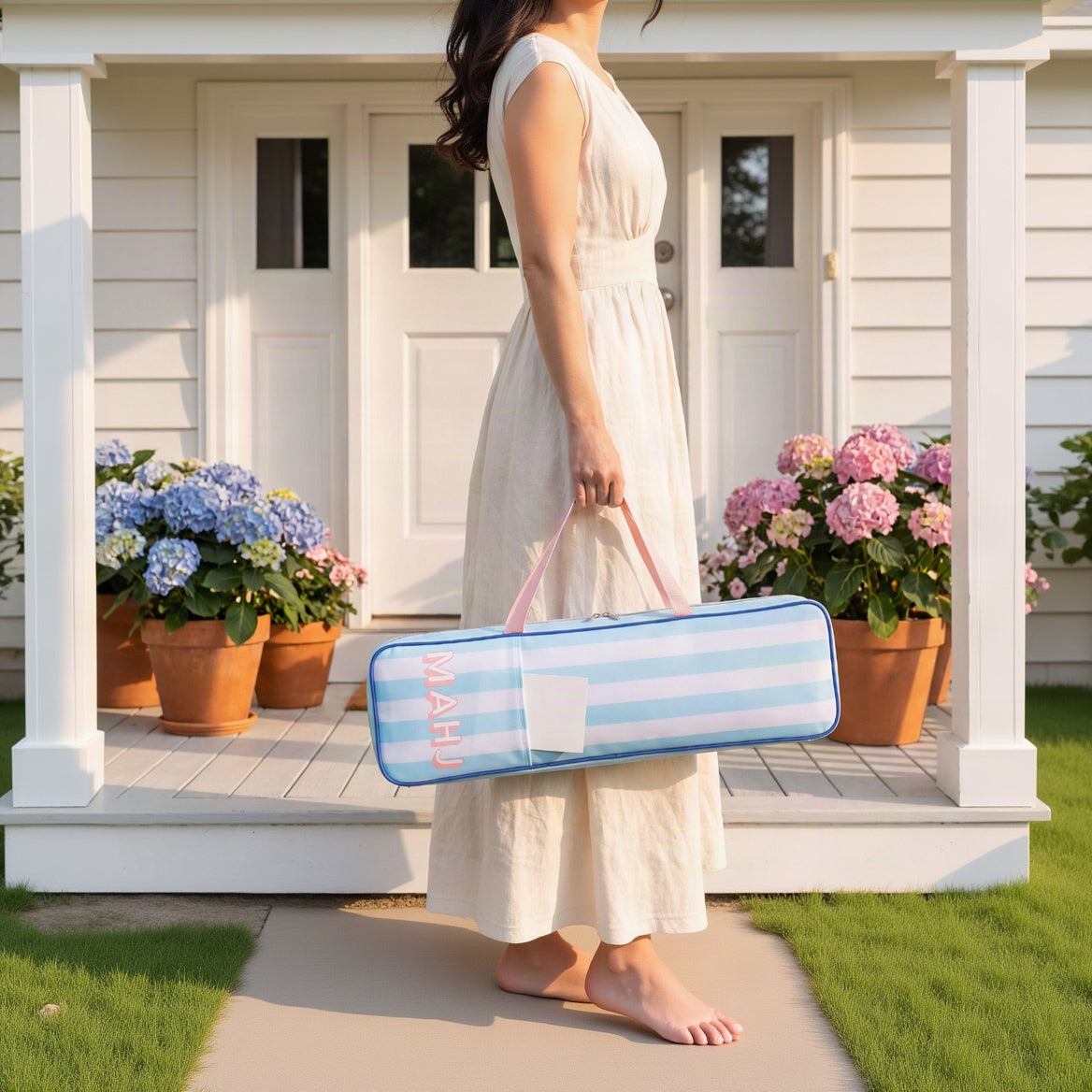Woman carrying a blue stripe mahjong rack bag