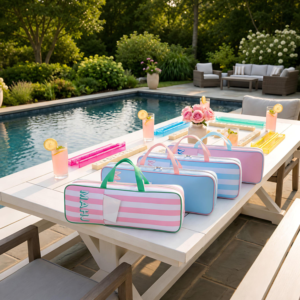 Striped mahjong rack bags in pink and blue by the pool