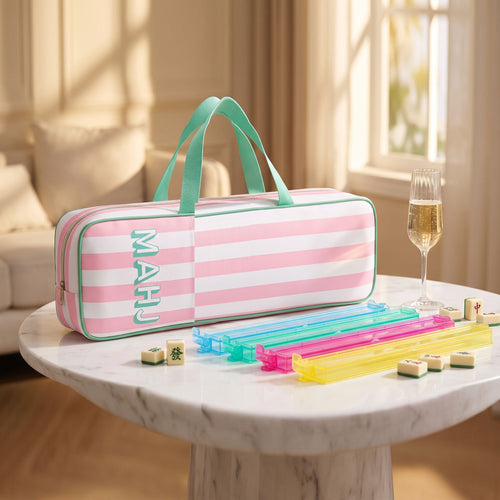 American Mahjong racks and rack bag bundle: pink striped MAHJ rack case with four colorful racks with pushers on a marble table
